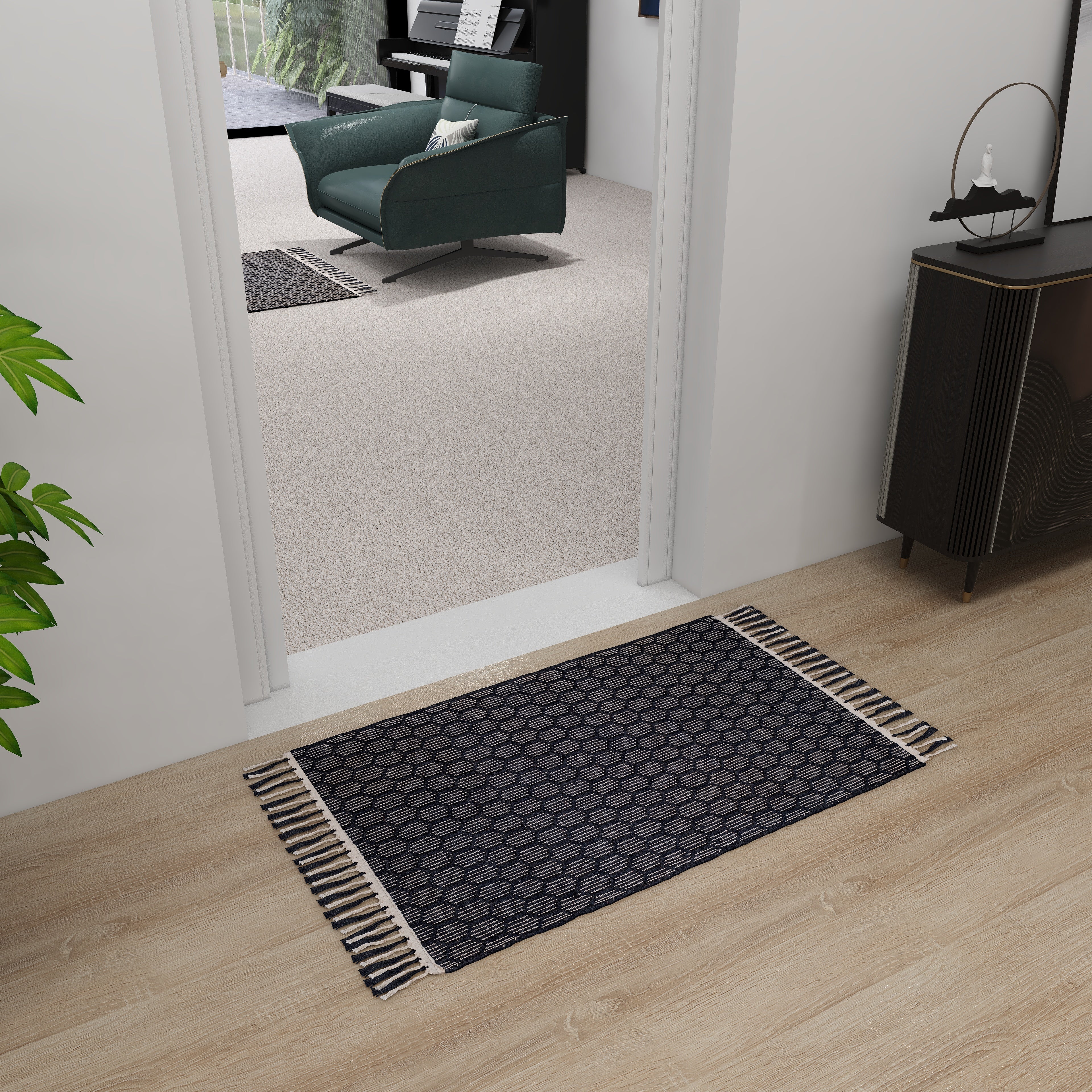 Black jute rug placed in front of door for natural and stylish entryway decor